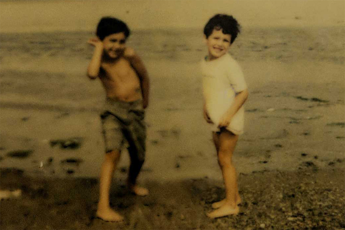 Yaz and Haz as kids on a beach somewhere